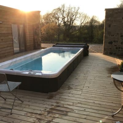 Spa pool in courtyard with countryside views design build Kent Sussex