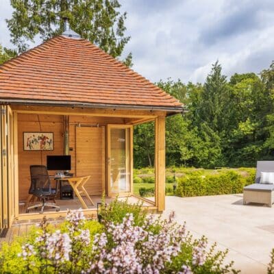 Garden office pool house with log burner and garden design build Sussex Kent