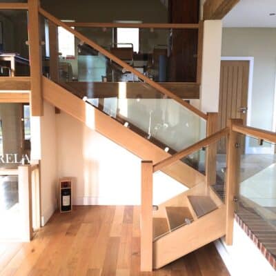Double height living bespoke oak and glass staircase barn conversion design build Kent Sussex